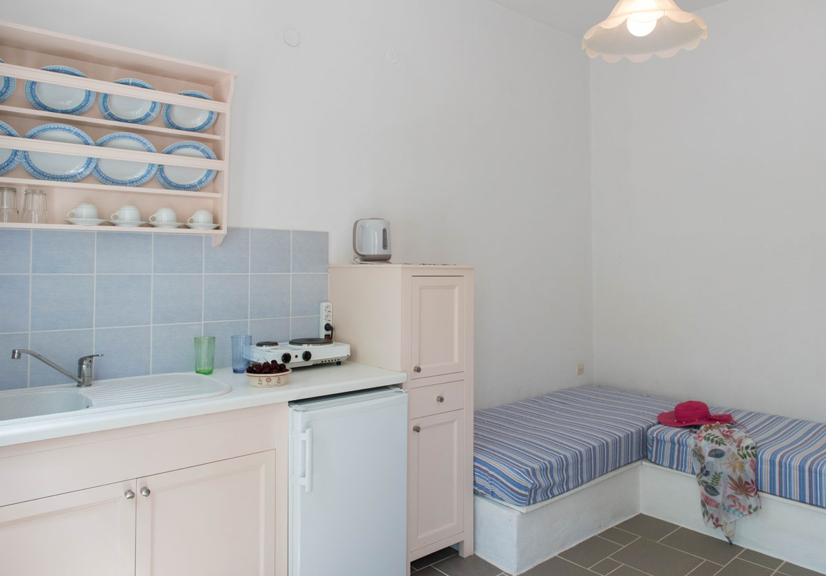 Kitchen and single beds